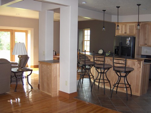 combo of kitchen and living area that is a 9 foot french door.