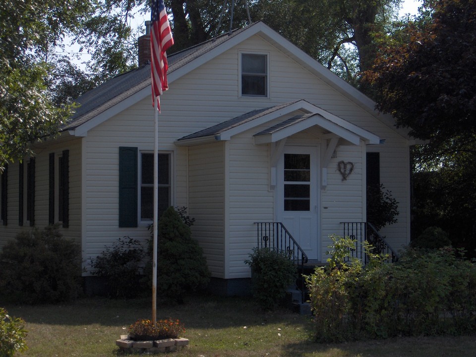 front of the house. notice the newer siding, shingles, and windows.