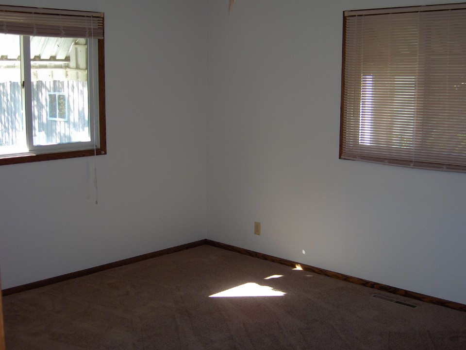 bedroom one with large closet and new carpet