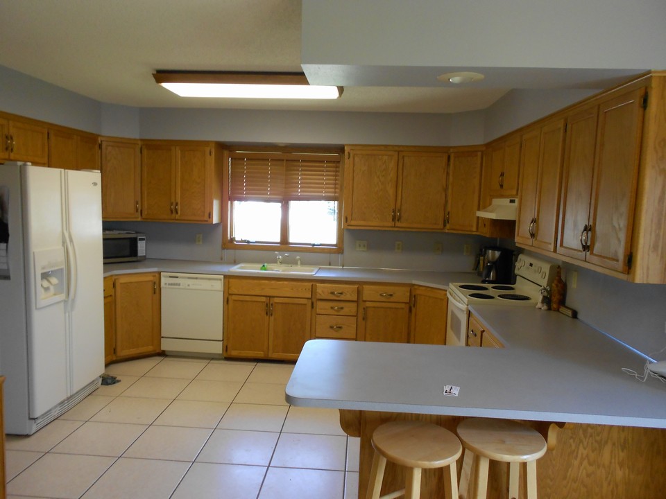 big kitchen with lots of cupboards