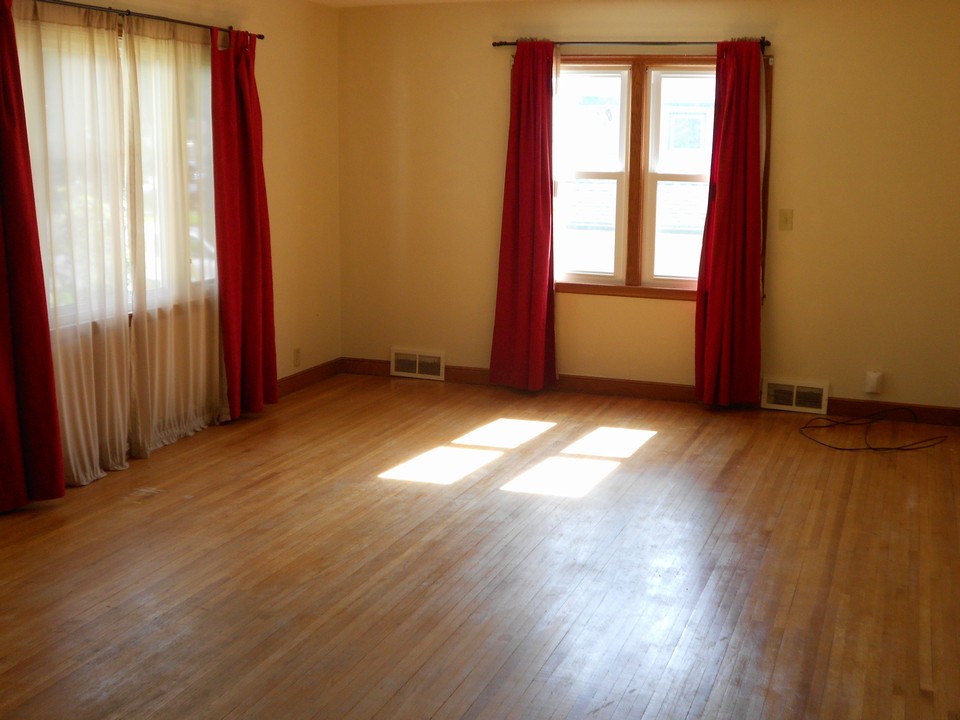 large living room with new windows and hardwood floors